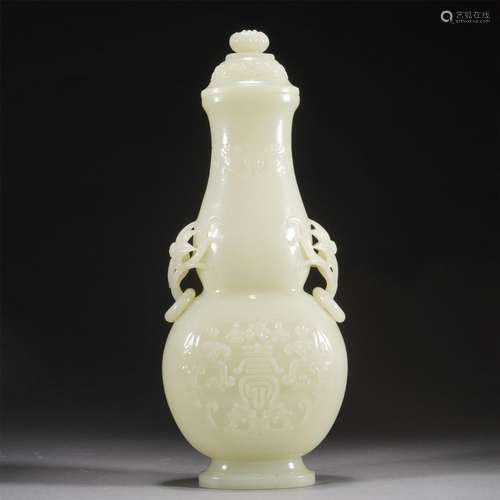 A CARVED JADE DOUBLE-GOURD VASE