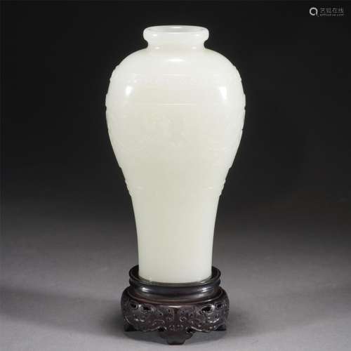 A CARVED WHITE JADE VASE WITH STAND