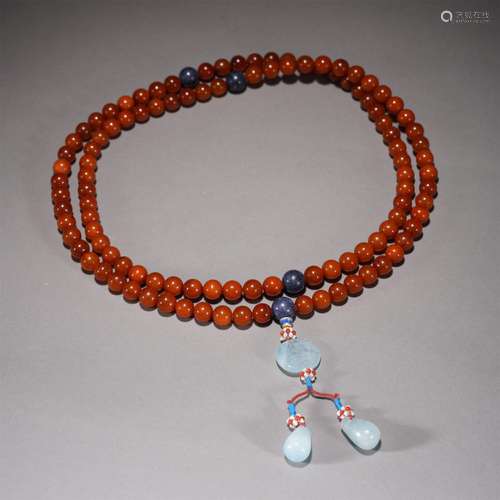 A CHINESE IMPERIAL AMBER ROSARY,QING