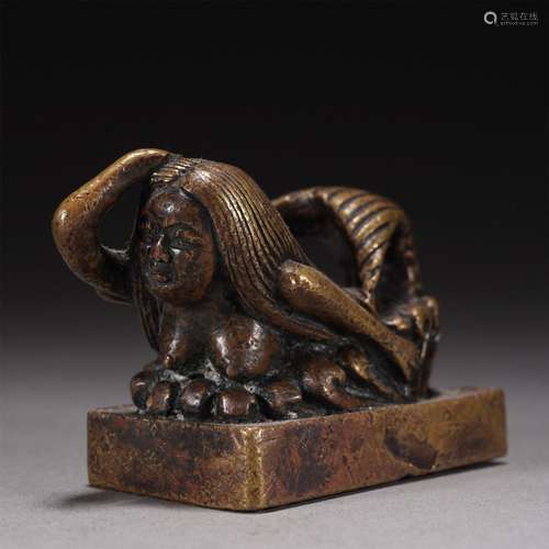 A CARVED BRONZE FIGURAL SEAL