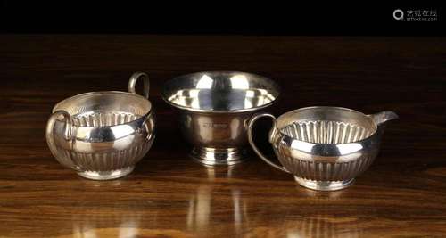 A Silver Semi-reeded Milk Jug & Sugar Bowl by James Deak...