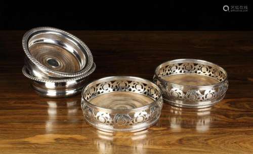 Two Pairs of 19th Century Silver Plated Bottle Coasters: One...