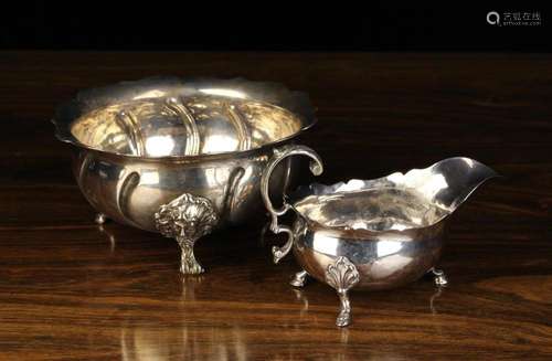 A Silver Metal Bowl with embossed wrythen fluting radiating ...