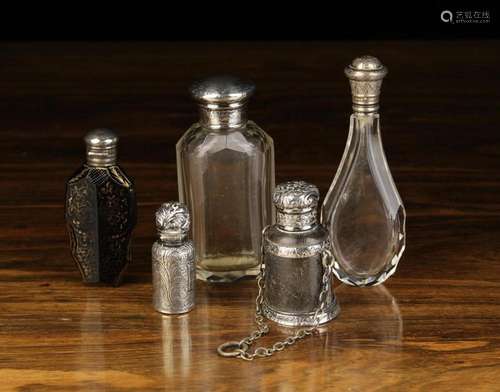 A Group of Five Antique Scent Bottles: A clear glass bottle ...