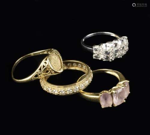 A Group of Four 9 Carat Gold Dress Rings; one inset with a m...