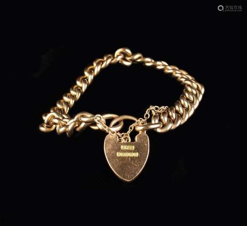 A Nine Carat Gold Curb Chain Bracelet with locket. (Approx 1...