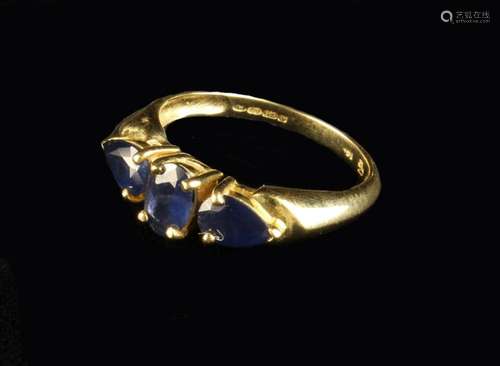 A 14 Carat Gold Ring set with three sapphires.