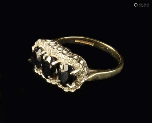 A 9 Carat Gold Lady's Ring with three oval sapphires sur...