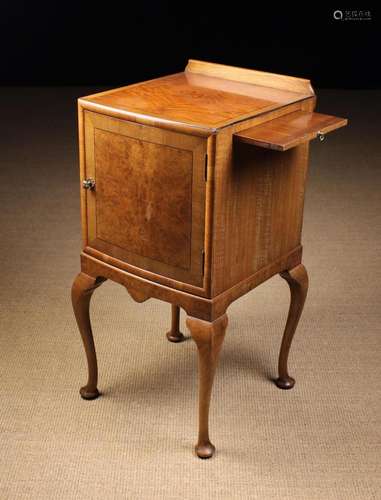 An Edwardian Walnut Bedside Cabinet inlaid with ebonised str...