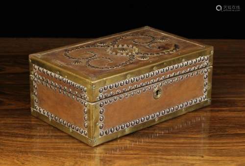 A 19th Century Leather Clad Box of rectangular form adorned ...