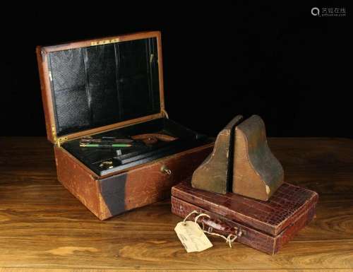 Two Leather Travelling Cases; a writing box & and jewell...