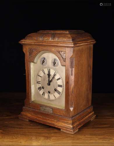 A Chiming Mantel Clock in Oak Case with presentation plaque ...