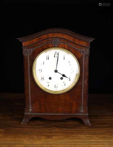 A Mahogany Cased Chiming Mantel Clock striking a gong. The m...