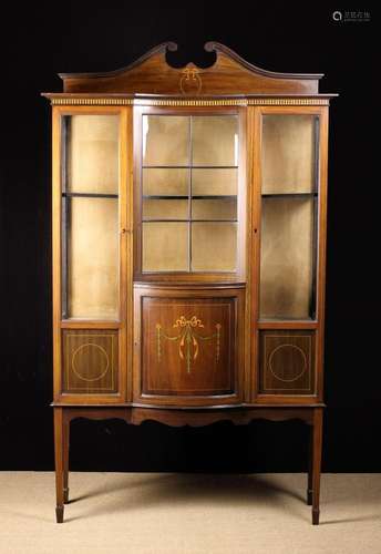 An Edwardian Mahogany Display Cabinet inlaid with stringing ...