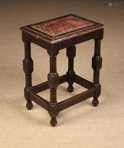 A Small Vintage Oak Stool with padded leather panel edged in...