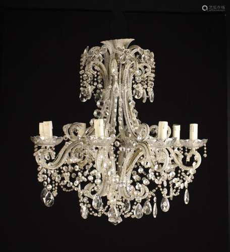 An Attractive Eight Branch Glass Chandelier. The scrolling f...