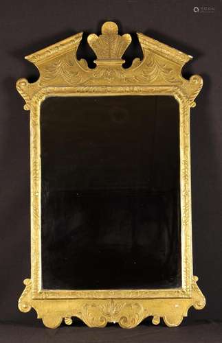 A George II Style Wall Mirror with a carved and gessoed gilt...