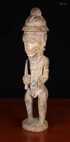 An Antique African Carved Wooden Figure of a Semi-naked Male...