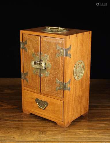 A Chinese Jewellery Cabinet. The top mounted with a brass sw...