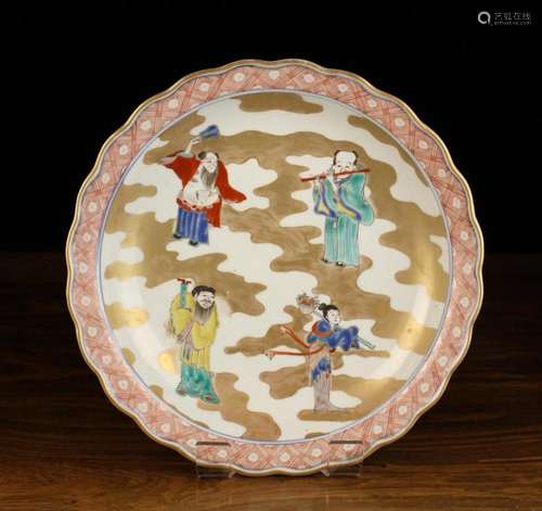 A Chinese Dish decorated with four enamelled figures to the ...