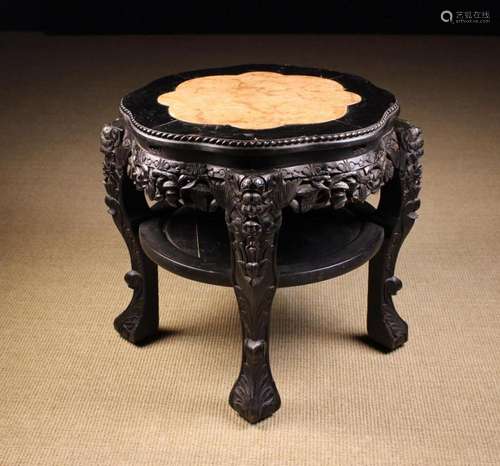 An Early 20th Century Chinese Ebonised Stand. The petalled t...