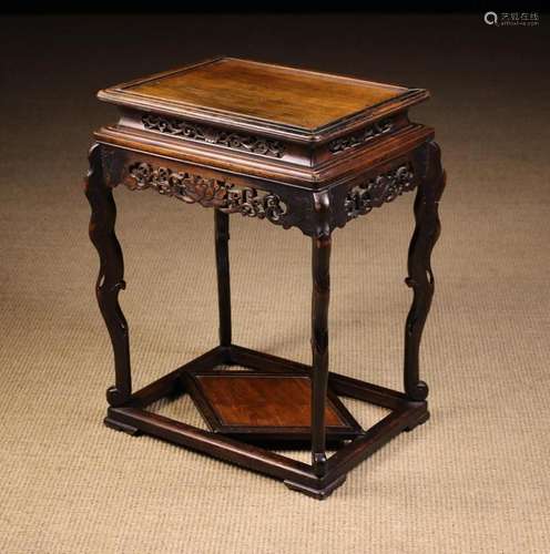 An Early 20th Century Chinese Style Stand. The moulded two t...