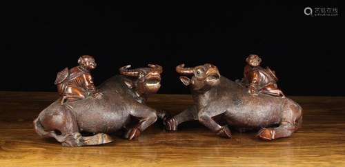 A Pair of Chinese Hardwood Carvings of paddy-field workers m...