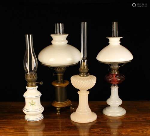 Three decorative oil lamps and an electric ''oil lam...