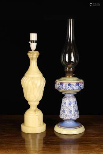 Two Vintage Lamps: A glass oil lamp printed with chintzy blu...