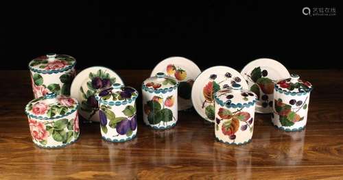 A Group of Wemyss Pottery: A set of four lidded conserve jar...