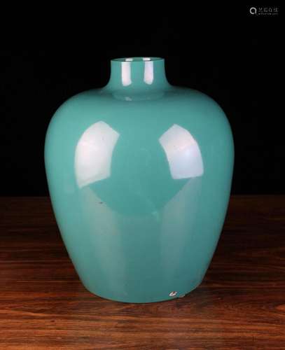 A Royal Worcester Green Glazed Vase with a raised cylindrica...