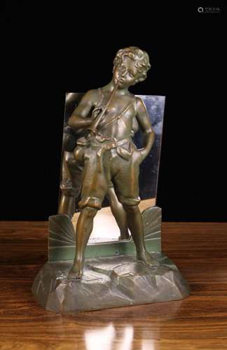 A Brown Patinated Spelter Figural Lamp modelled as a boy blo...