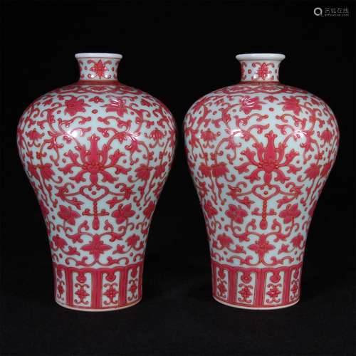 A pair of pink lotus and plum vases