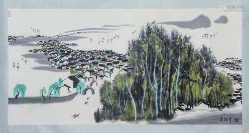 A CHINESE PAINTING OF HOUSES AND TREES