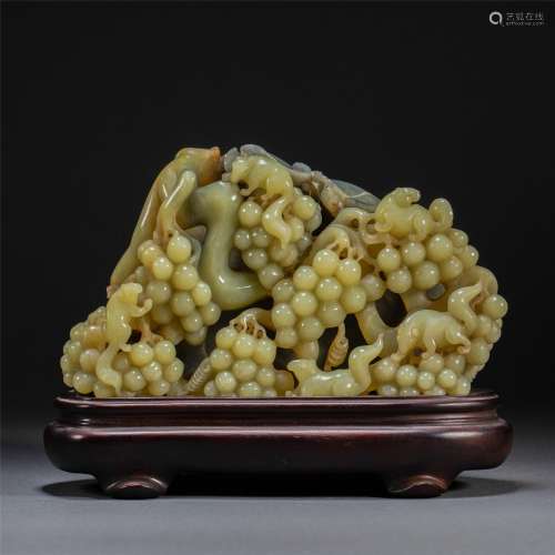 A CHINESE YELLOW JADE SQUIRREL AND GRAPES ORNAMENTS