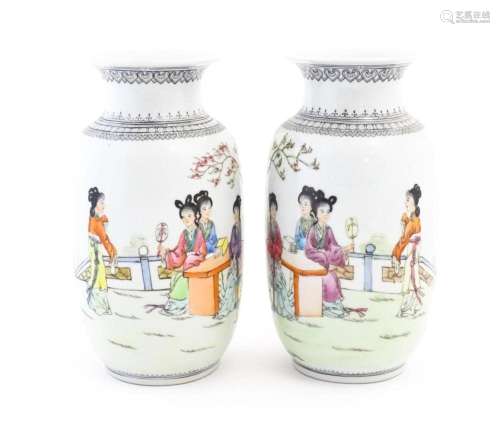 A pair of Japanese vases decorated with female figures in a ...