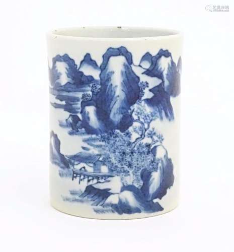 A Chinese blue and white brush pot of cylindrical form decor...