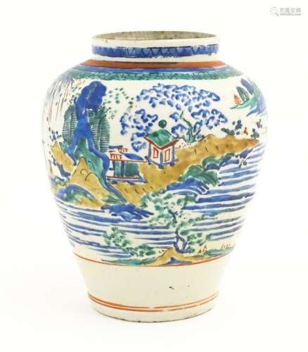 A Japanese Kakiemon style jar / vase of ovoid form decorated...