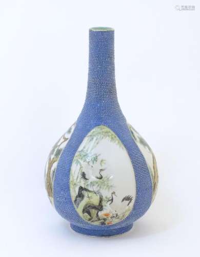 A Chinese bottle vase with panelled decoration depicting cra...