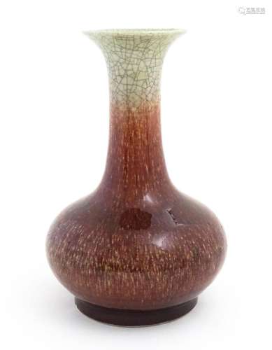 A Chinese sang de boeuf vase with a flared rim and crackle g...