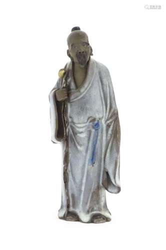 A Chinese mud man figure depicted wearing robes. Approx. 7 1...