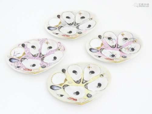 Four Union Porcelain Works oyster plates of shell form with ...