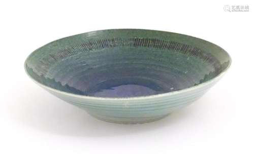 A studio pottery bowl by Mike / Michael Dixon with blue / gr...