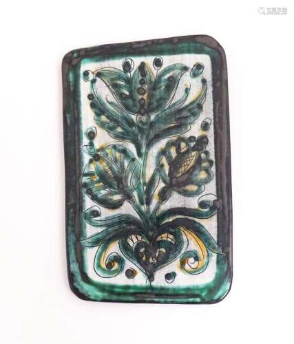A studio pottery tile by Burkart Handarbeit, with floral and...