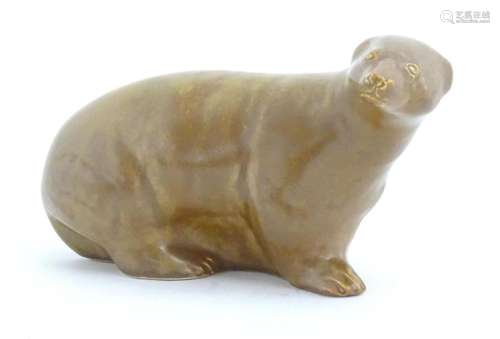 A ceramic model of a brown bear. Approx. 9" wide