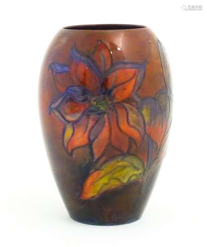 A Moorcroft pottery flambe vase of tapering ovoid form decor...