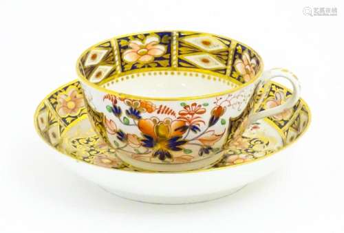 A Derby porcelain tea cup and saucer decorated in the Imari ...