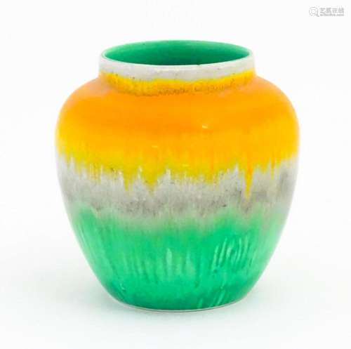 A Shelley Art Deco vase / jar with a drip glaze in orange, g...