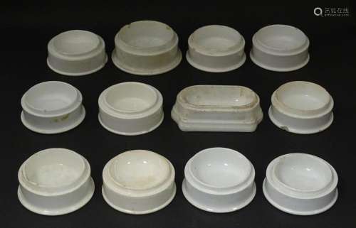 Twelve assorted pot lid bases, one marked Crosse & Black...