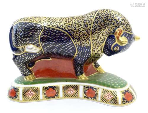 A Royal Crown Derby paperweight modelled as a Grecian Bull d...